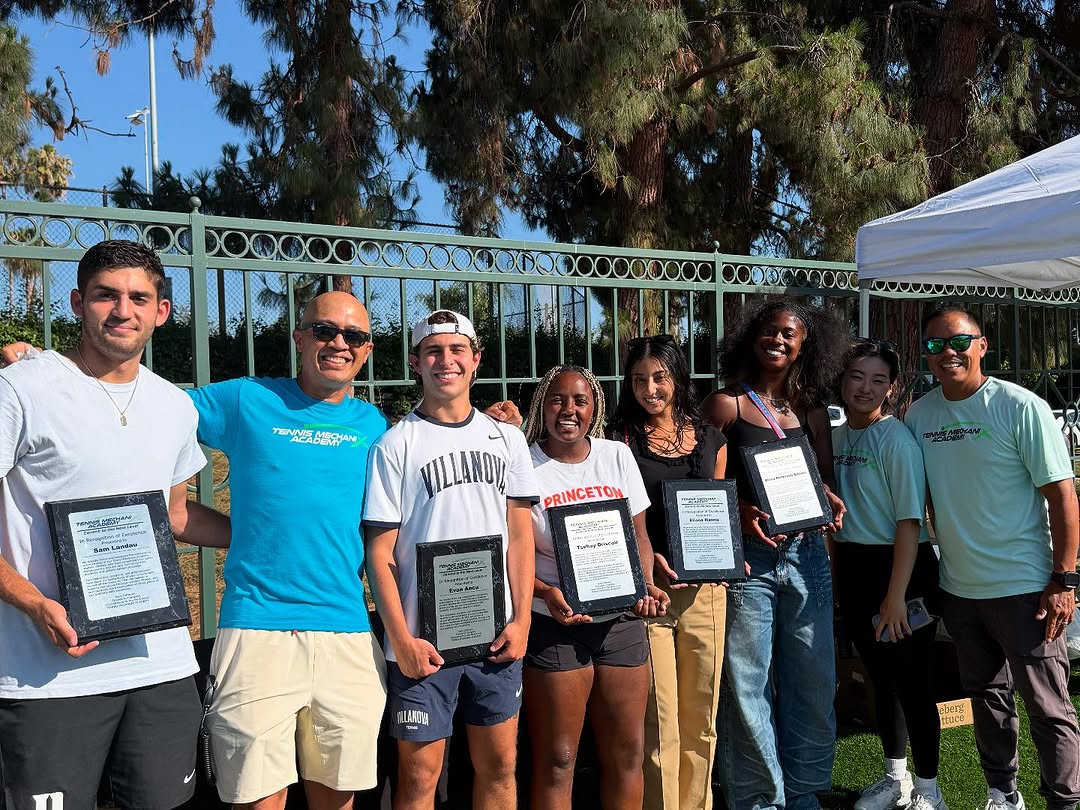 Students holding recognition plaques