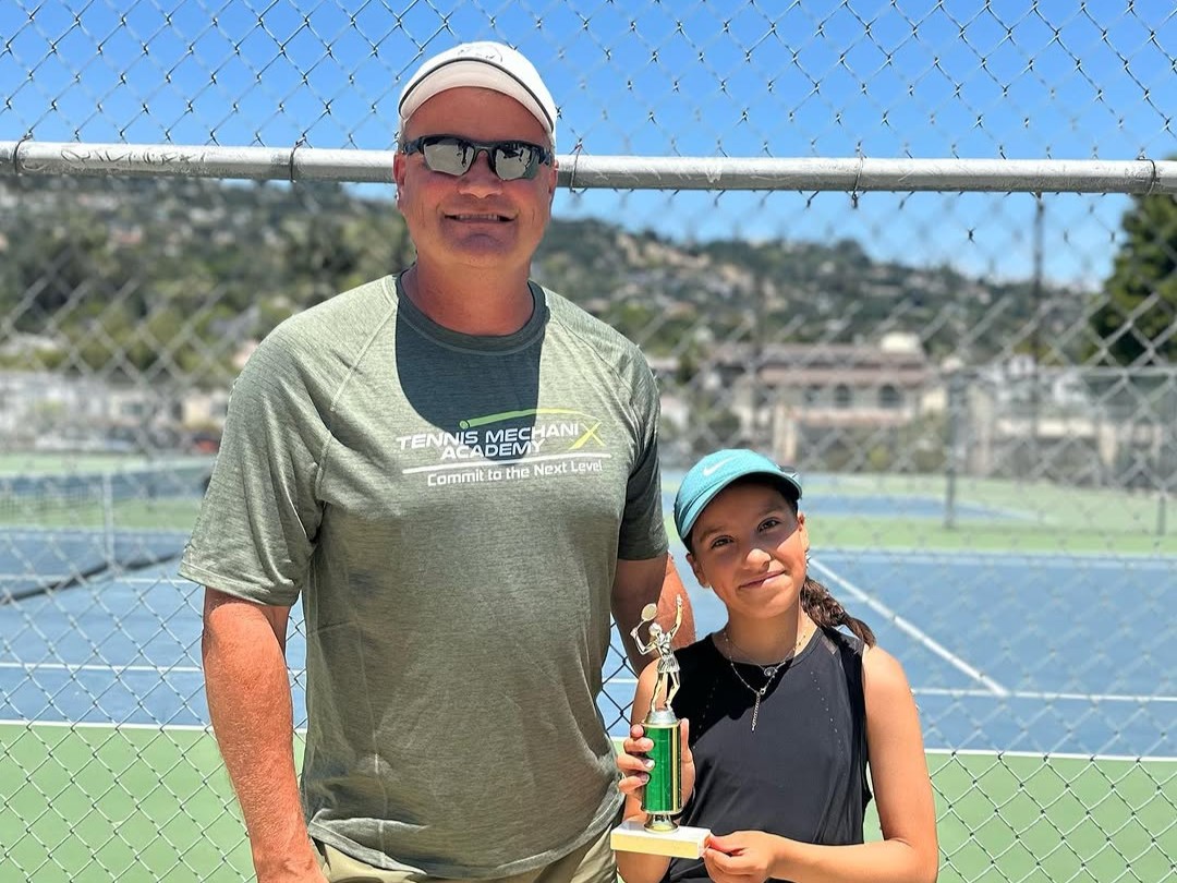 Coach Henrik with a student