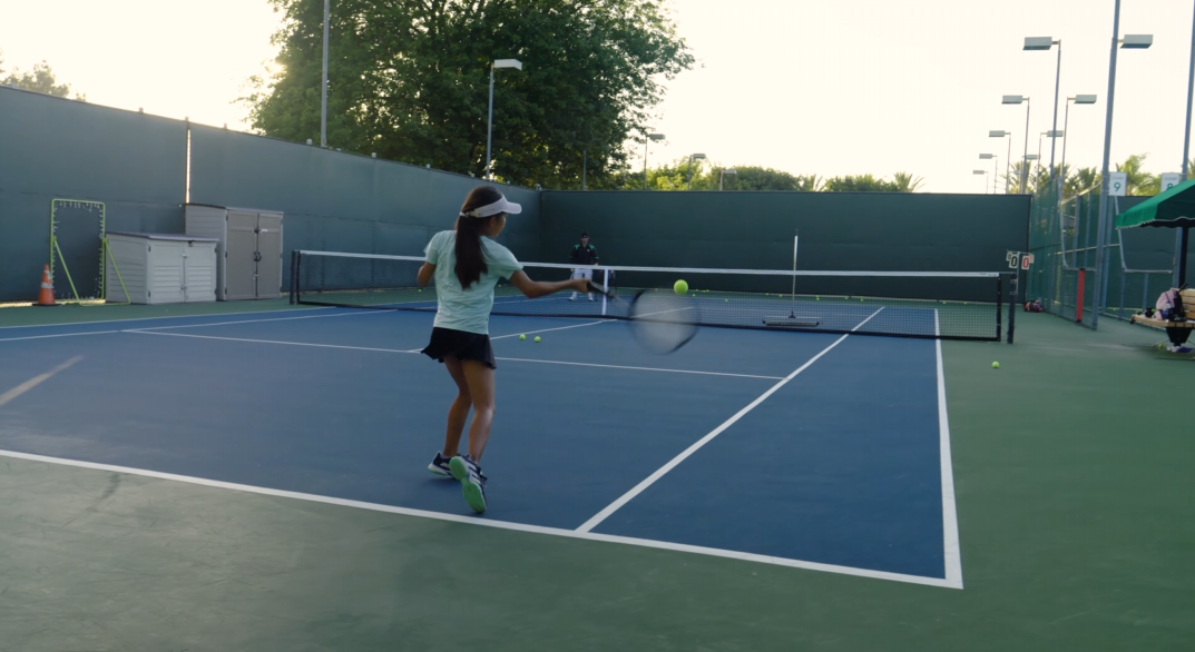 Student practicing forehand strokes