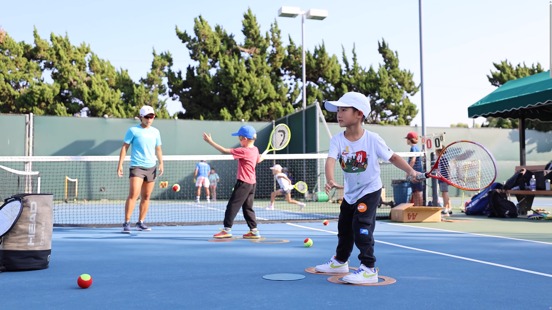 Young player learning forehand technique