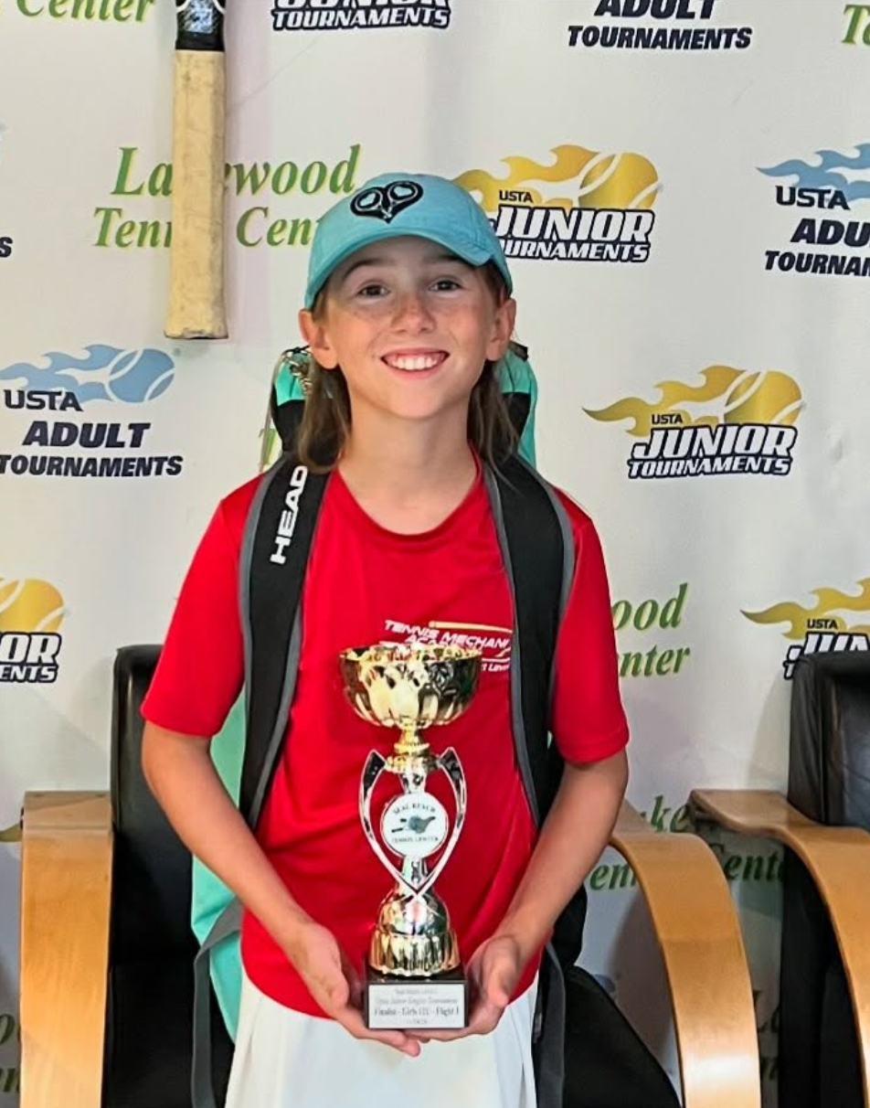 JTMX student with a trophy