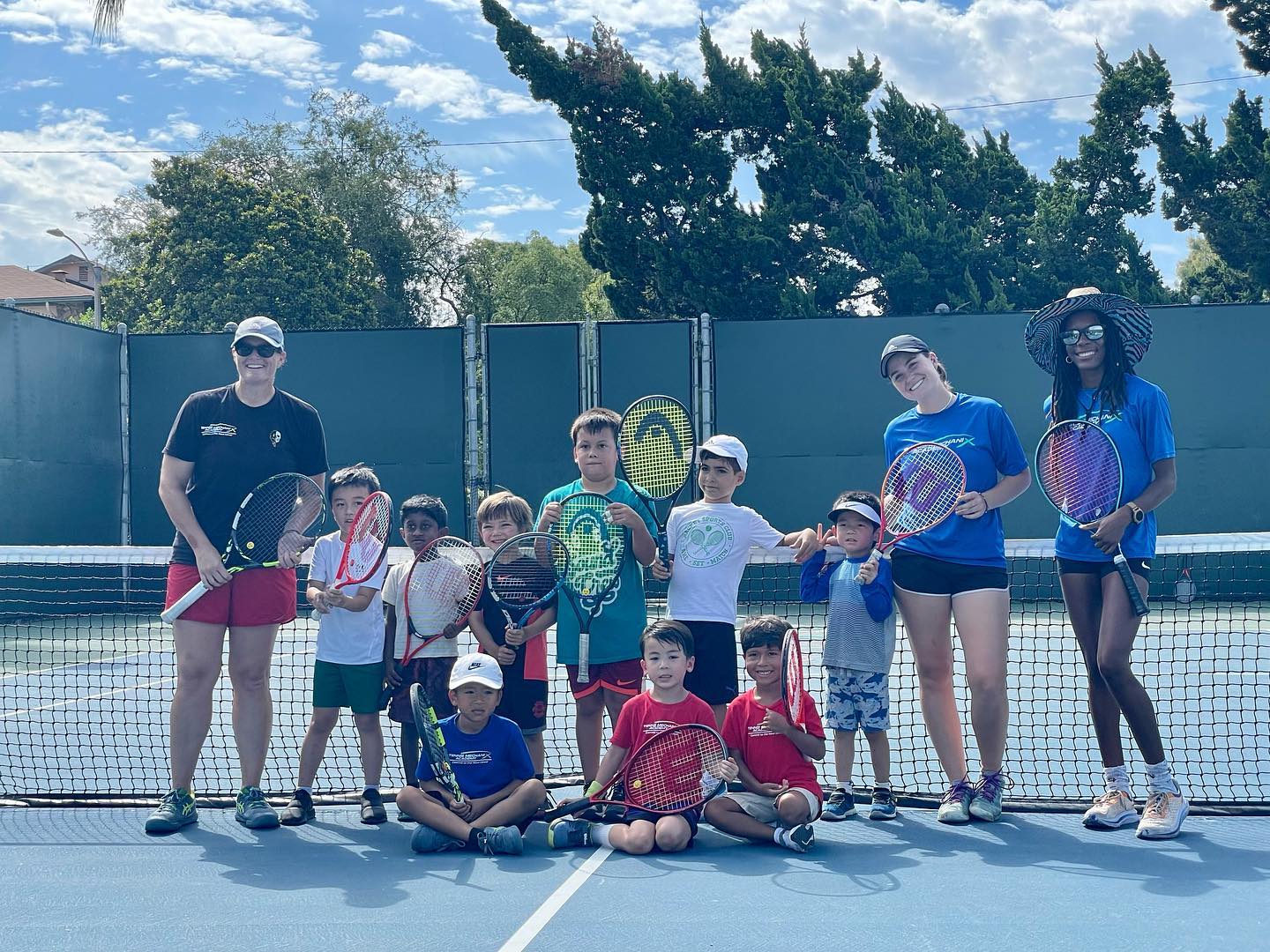 Group phot of TMX Summer Camp students with coaches